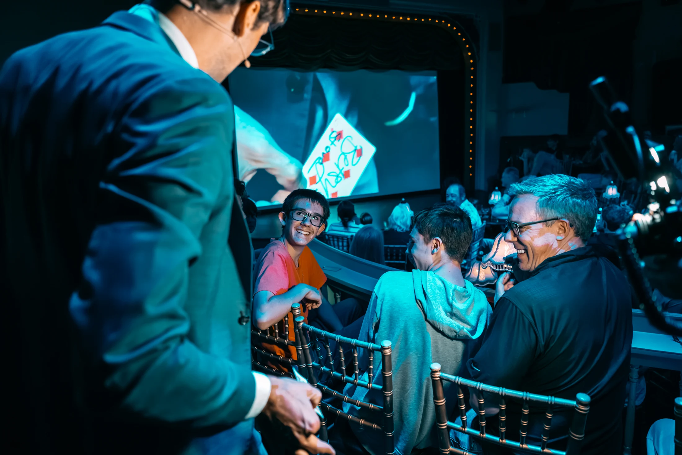 Kevin sharing a moment of magic with smiling guests
