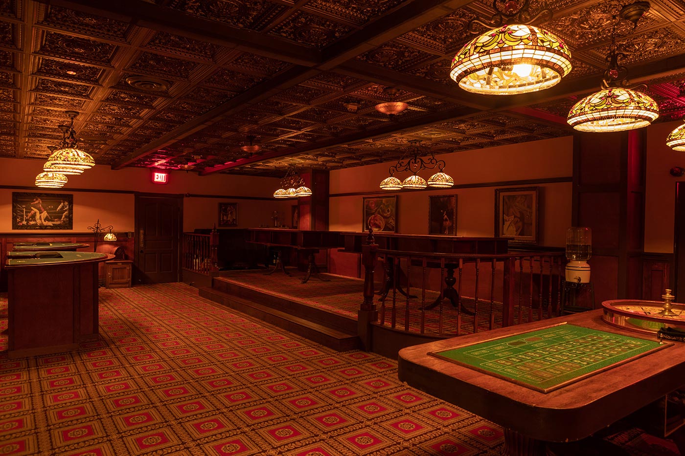 Gaming tables in the Palace Theater’s casino room