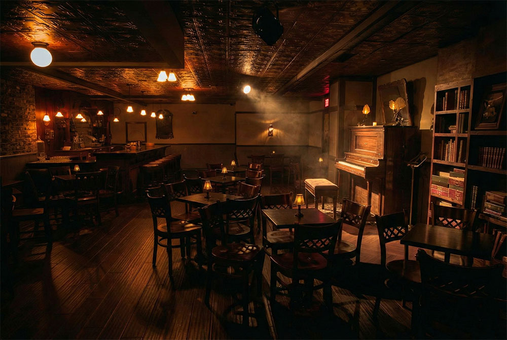 The main bar and its warmly lit stage at the Palace Theater
